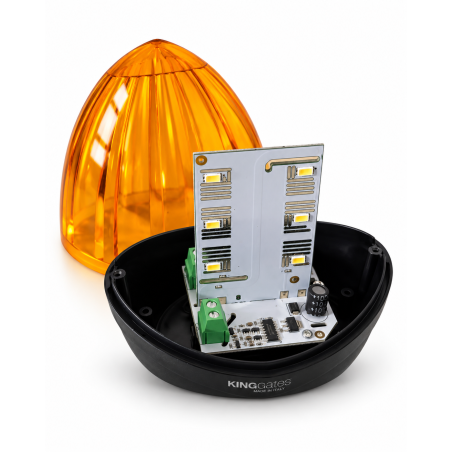 Lampe de signalisation à LED avec optique orange et boîtier noir, carte électronique et bouchon d’alimentation.